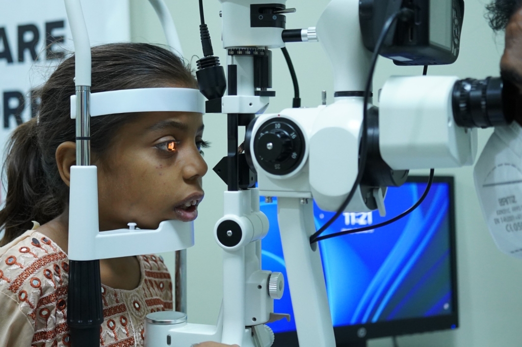 Child receiving an eye assessment